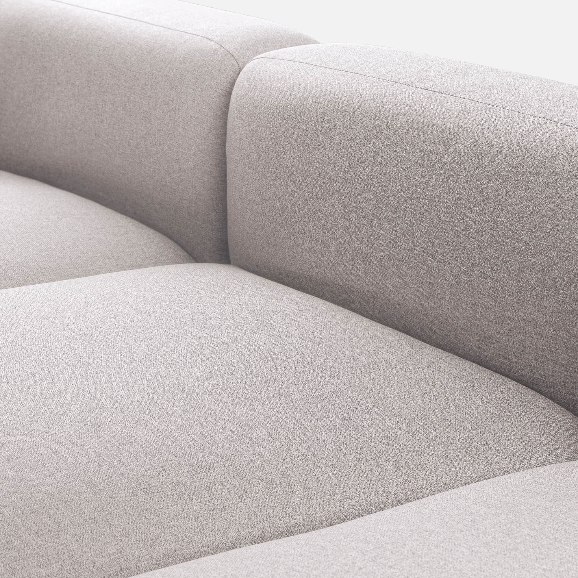 Detailed view of the Luca Double Chaise Sectional Sofa's beige fabric upholstery